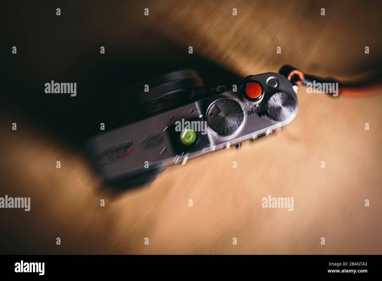 Red shutter button on a vintage rage finder photography camera Stock Photo