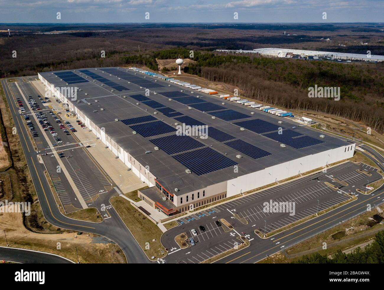 North East, MD, USA. 27th Mar, 2020. March 27, 2020: The Amazon warehouse in North East, Maryland remains active during the COVID-19 pandemic, in spite of more than 100 trailer sitting empty waiting to be filled. Even with shut downs, quarantines and stay at home orders throughout the country, the 1.15 million square foot facility is still fulfilling orders around the globe. As of March 27, 2020 there have been more than 100,000 cases of infection by coronavirus in the United States, resulting in more than 1,500 deaths. Scott Serio/Eclipse Sportswire/CSM/Alamy Live News Stock Photo