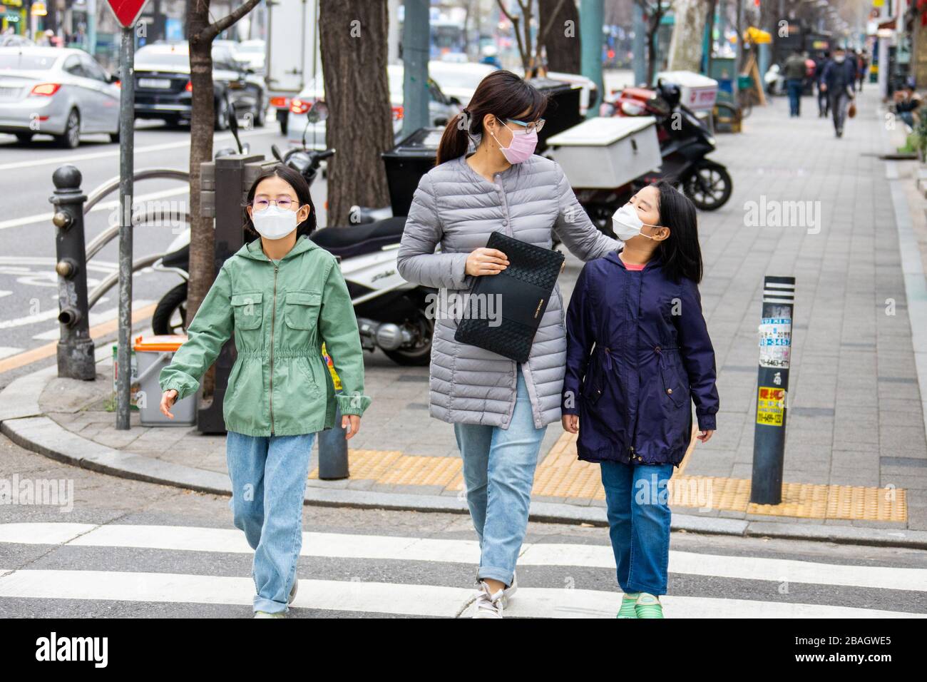Mother and daughter wearing masks during the Coronavirus pandemic, Seoul, Korea Stock Photo