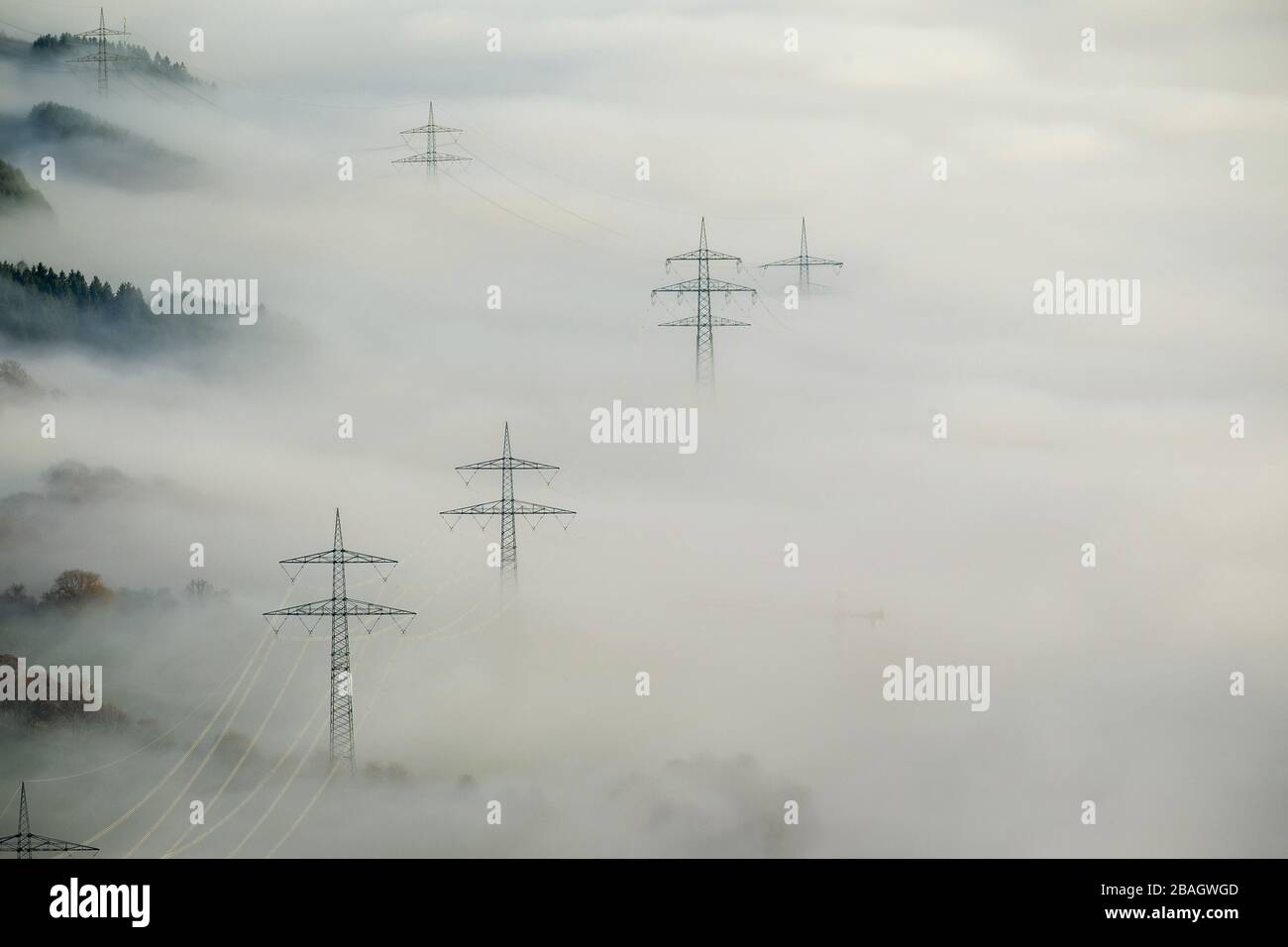 , Overland power lines in mist in Bestwig, 11.12.2013, aerial view, Germany, North Rhine-Westphalia, Sauerland, Bestwig Stock Photo