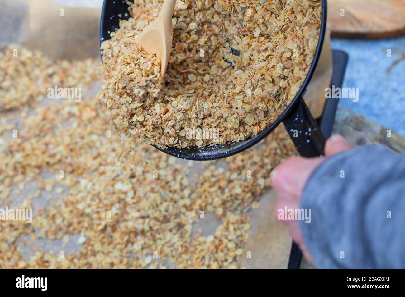 making bird seed with cereal and oil, series picture 3/4 Stock Photo