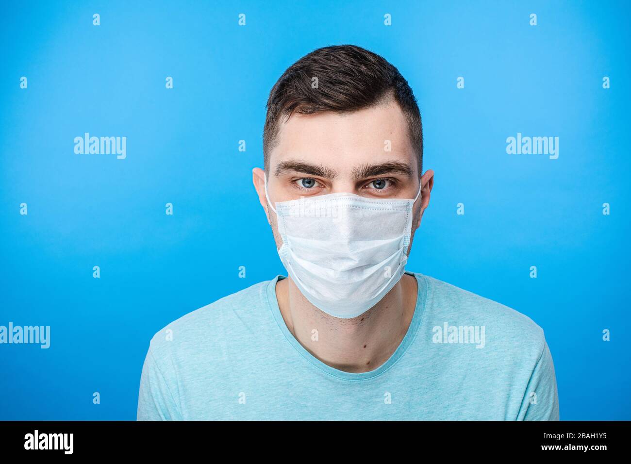 Male posing with surgical mask on face in studio Stock Photo - Alamy