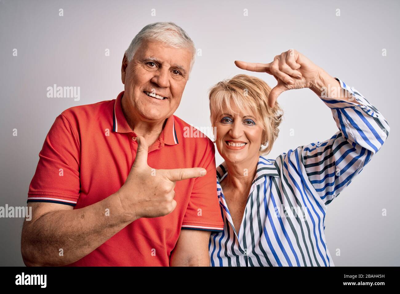 Senior beautiful couple standing together over isolated white ...