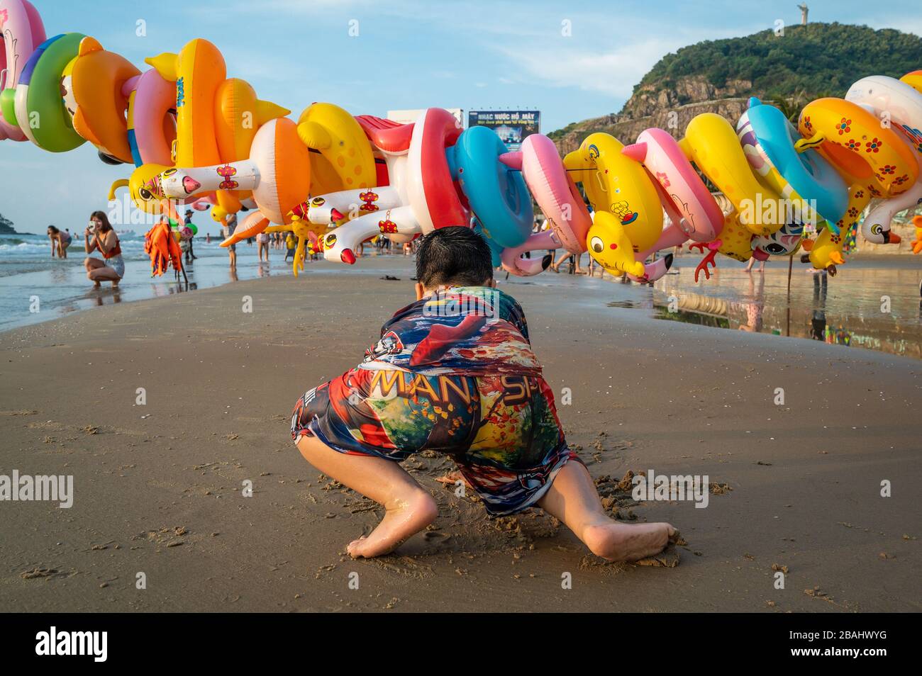 Vietnamese in the early morning on Back Beach, Vung Tau, Vietnam Stock Photo