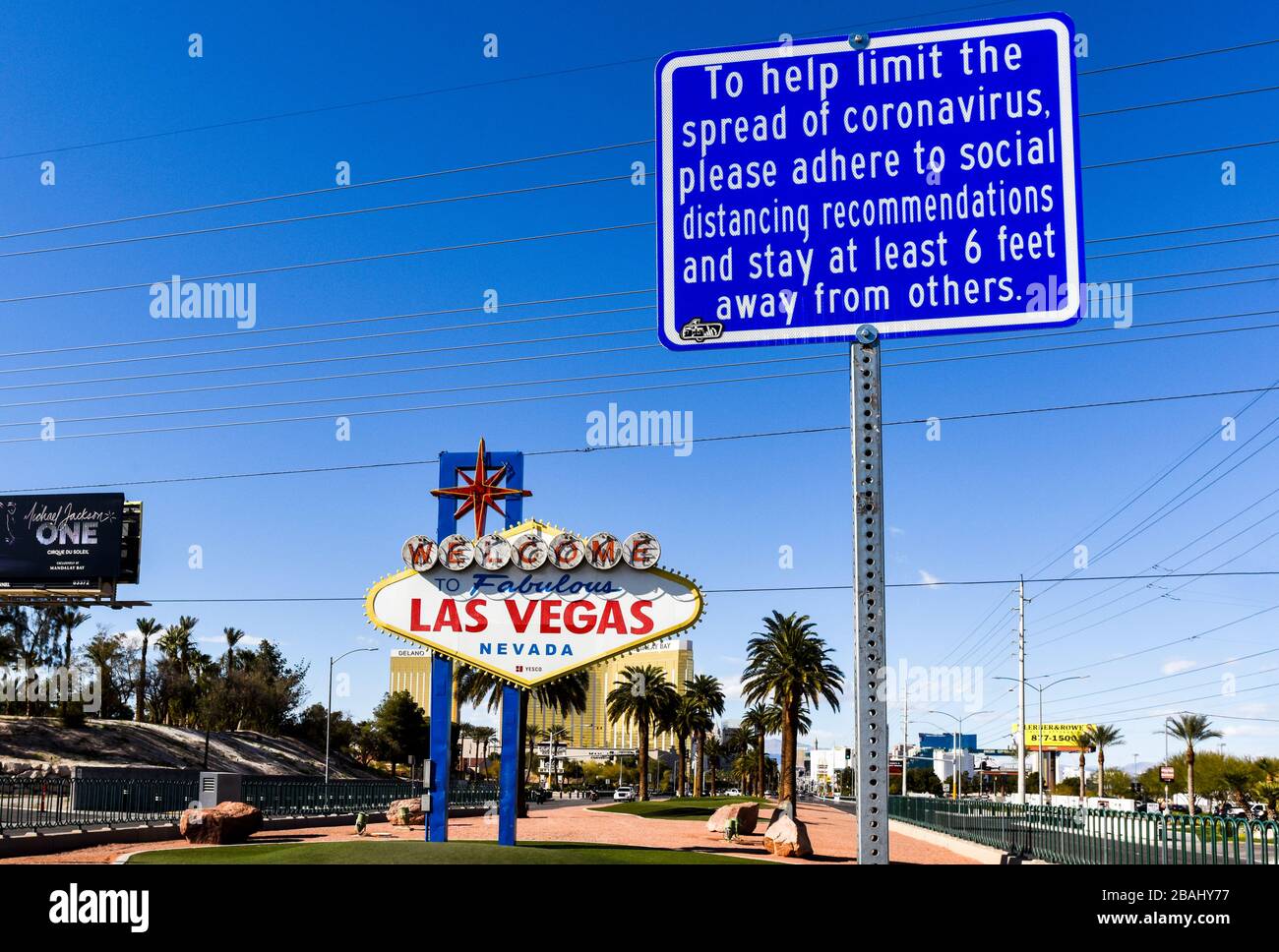A Social Distancing sign near the iconic Welcome to Las Vegas Sign. One week into the Las Vegas shut down due to Coronavirus, the Strip is fairly empty. Most residents seem to be heeding Governor Sisolak’s request you “Stay home for Nevada” with evidence of throughout Clark County, NV. The Empty Streets of Las Vegas Near Welcome to Las Vegas Sign on Las Vegas Blvd. Photo Credit: Ken Howard/Alamy Stock Photo