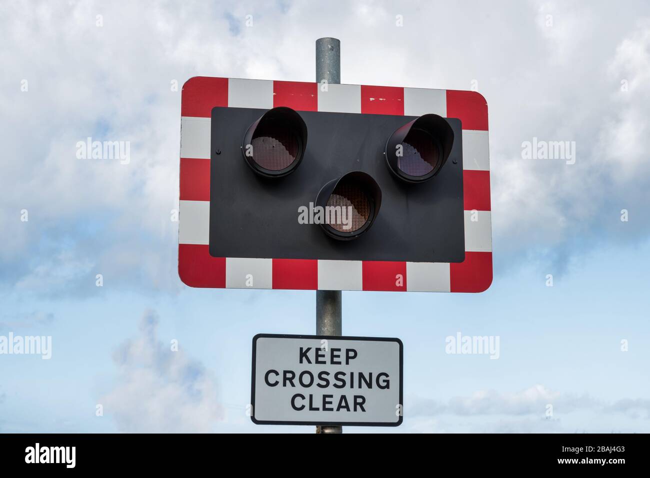 Railroad crossing sign located in Northern Ireland Stock Photo