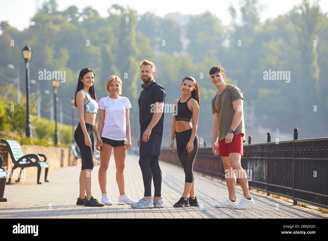 A group of athletes training in the park. Stock Photo