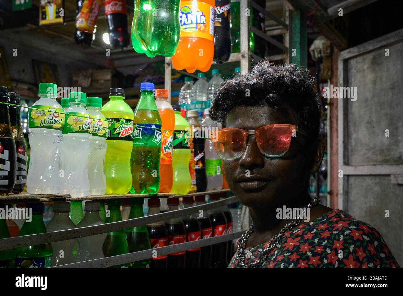 Portrait of a young  man with flashy sunglasses, Marina Beach, Chennai, India Stock Photo