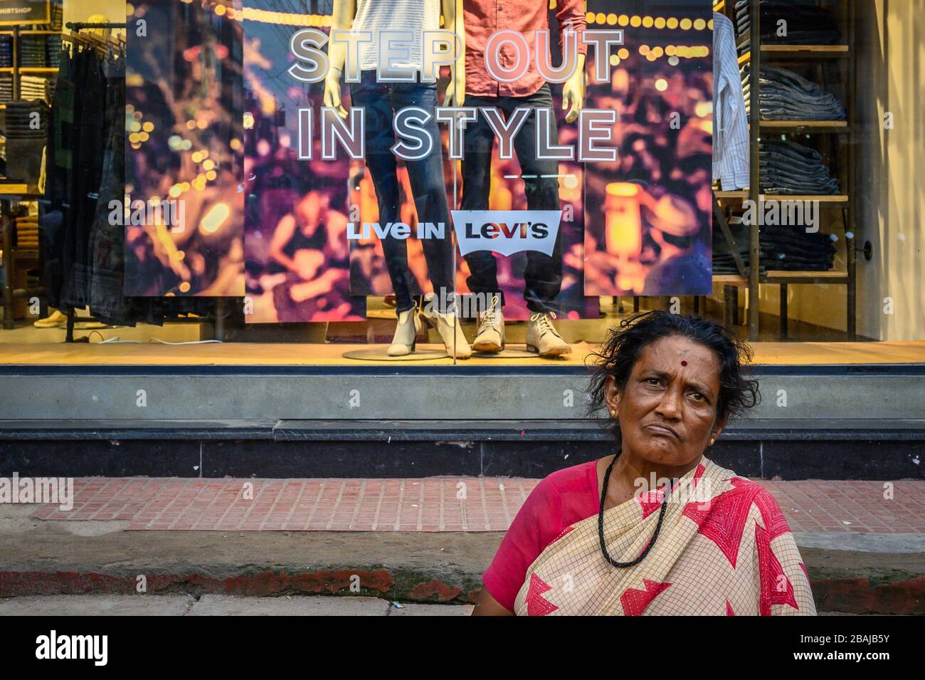 Street portrait of a woman  in front of a shop, Madurai, India Stock Photo