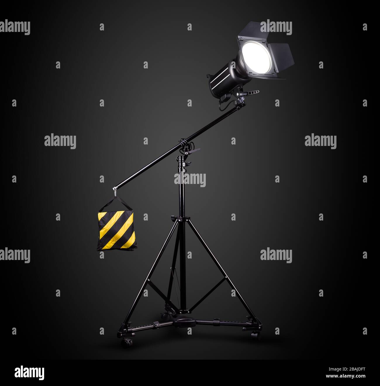 Photography studio flash on a lighting stand isolated on black background Stock Photo Alamy