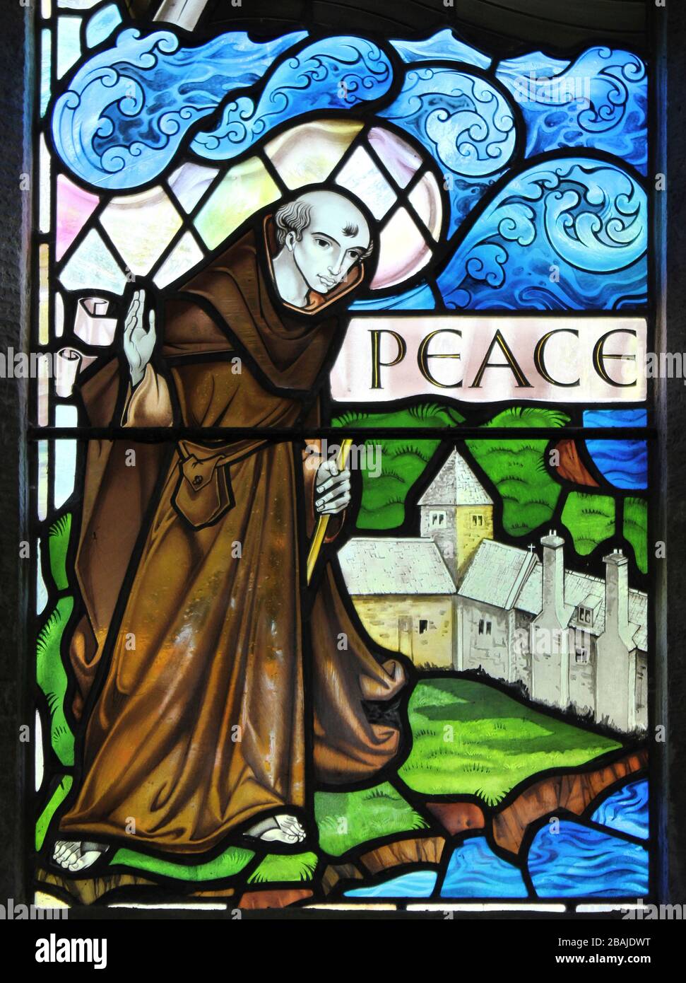 Stained Glass Window Showing St Seiriol a Medieval Welsh Saint who created a cell at Penmon Priory on Anglesey Stock Photo