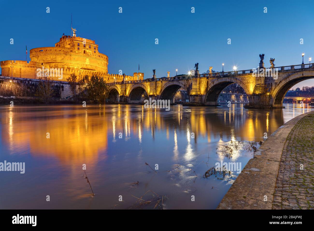 The Castel Sant Angelo and the Sant Angelo bridge in Rome at night Stock Photo