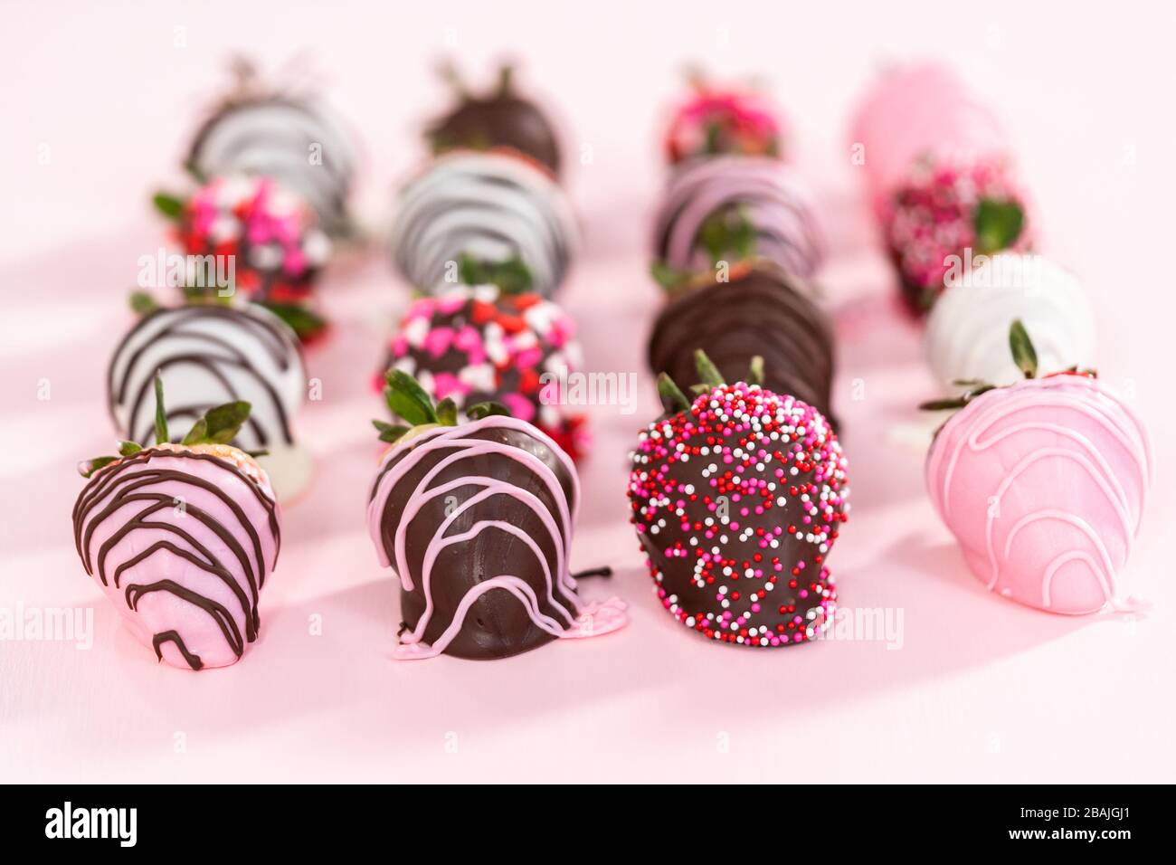 Variety of chocolate dipped strawberries on a pink background Stock ...