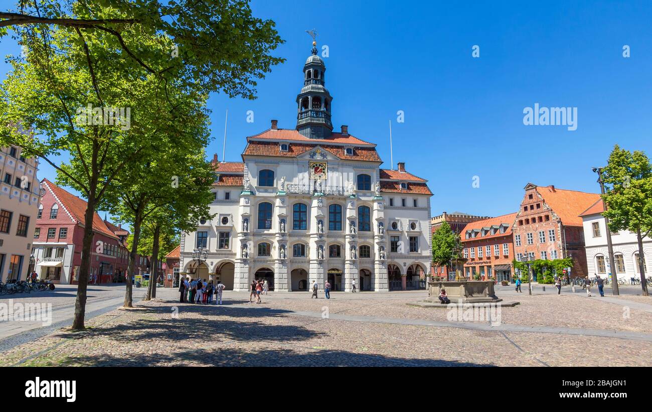 Lüneburg, Germany – 11. June 2015: Market square and town hall in the old town of Lüneburg. Locals and tourists meet here. This landmark is important Stock Photo