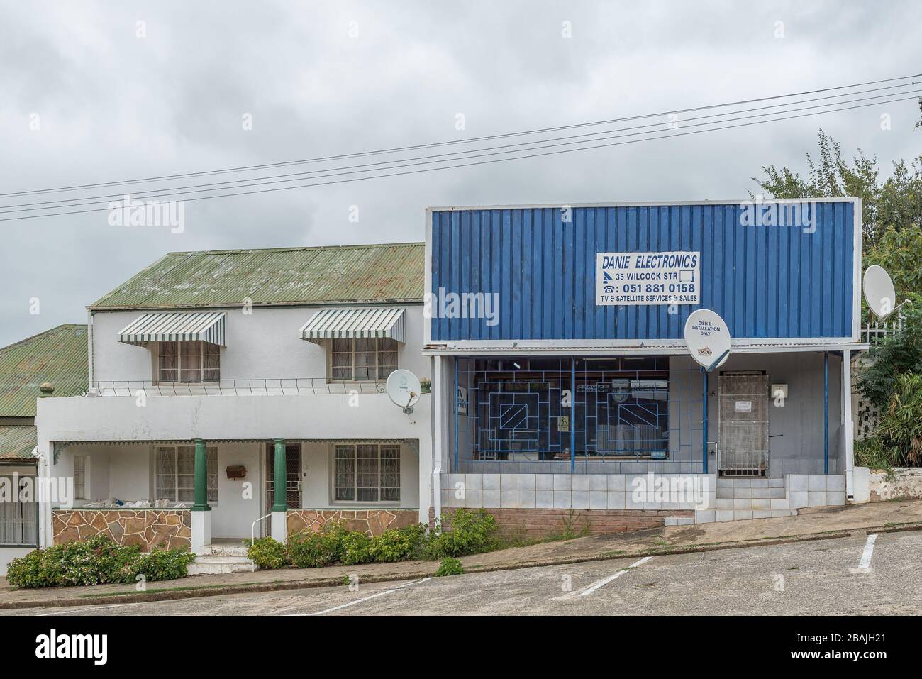 WINBURG, SOUTH AFRICA - MARCH 1, 2020: A street scene, with an electronics store and house, in Winburg, a small town in the Free State Province Stock Photo