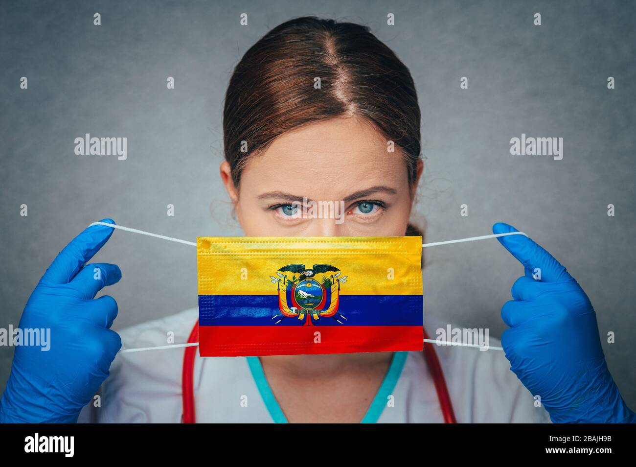 Coronavirus in Ecuador Female Doctor Portrait hold protect Face surgical medical mask with Ecuador National Flag. Illness, Virus Covid-19 in Ecuador, Stock Photo