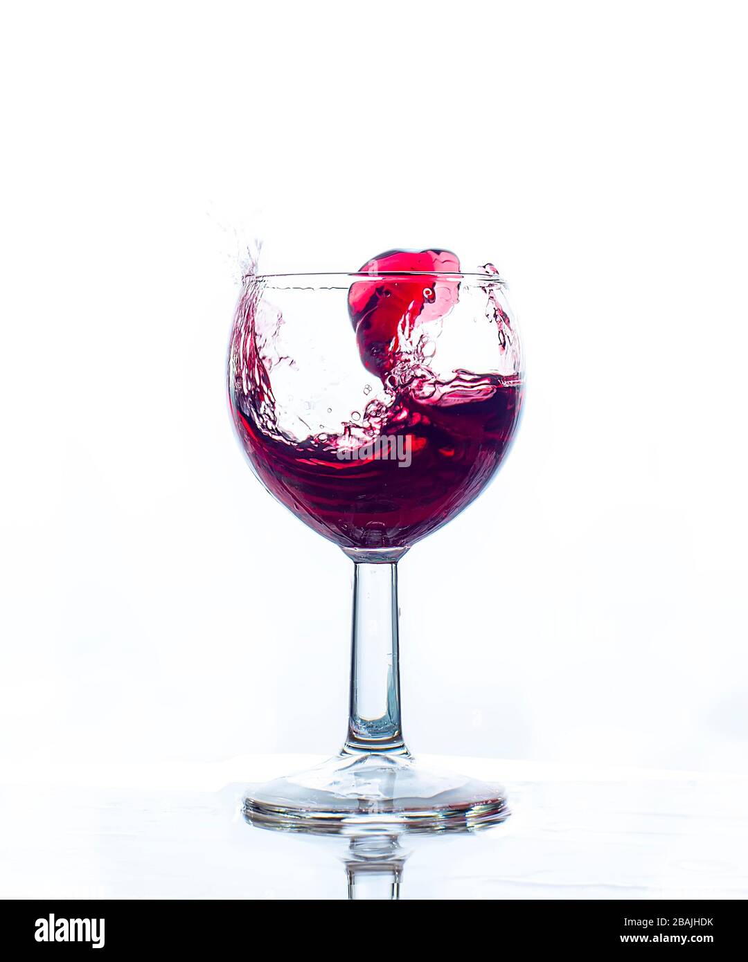 glass splash red wine with white background celebration Stock Photo