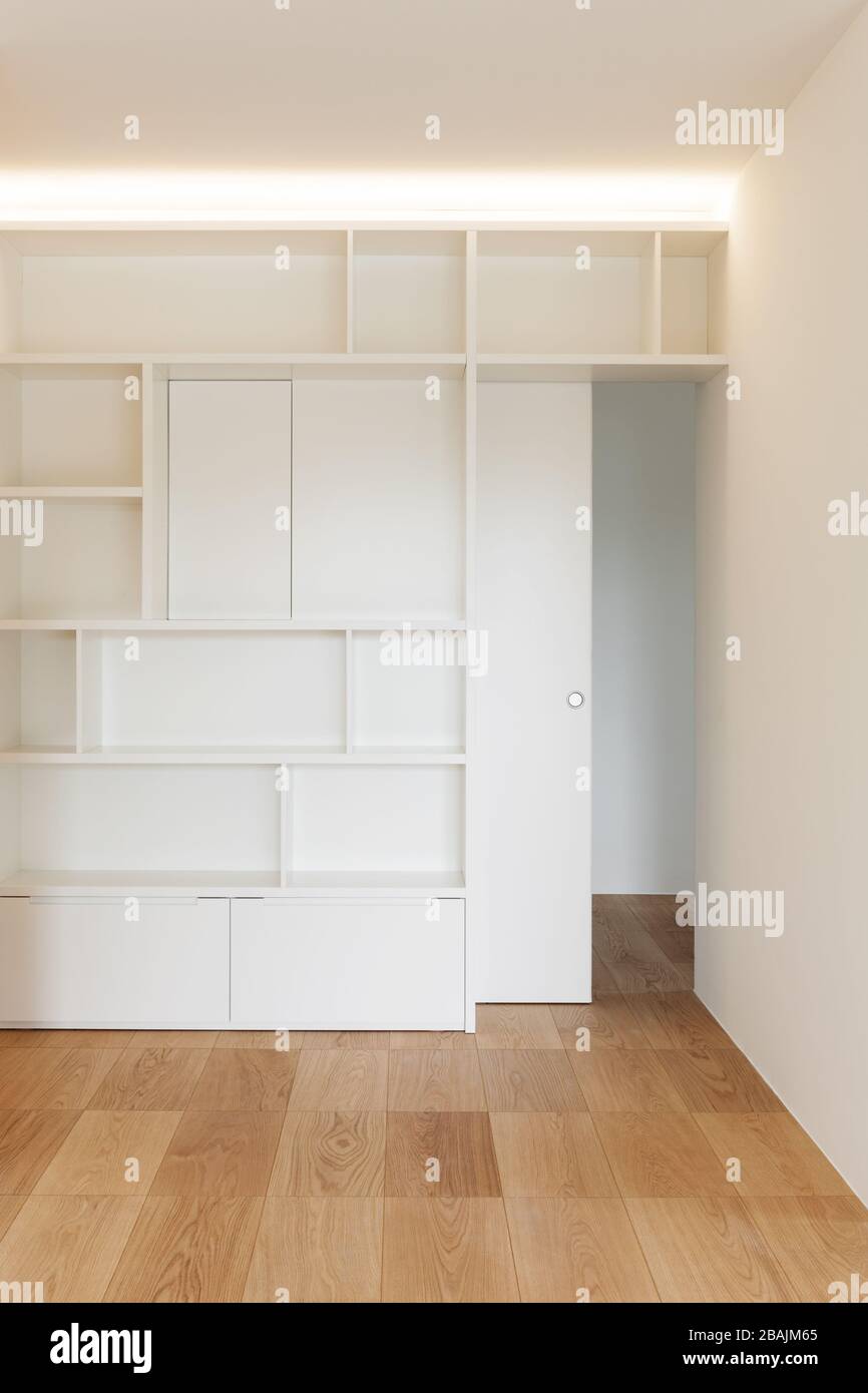 Architecture, empty room of a new apartment, white bookcase Stock Photo ...