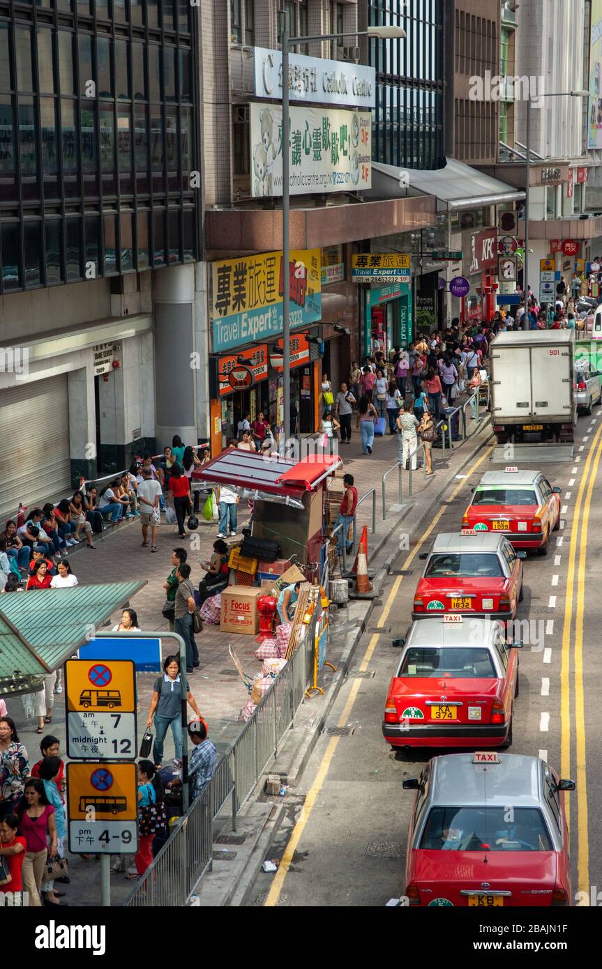 Foreign workers on their day off make the central area of Hong Kong very crowded. Stock Photo