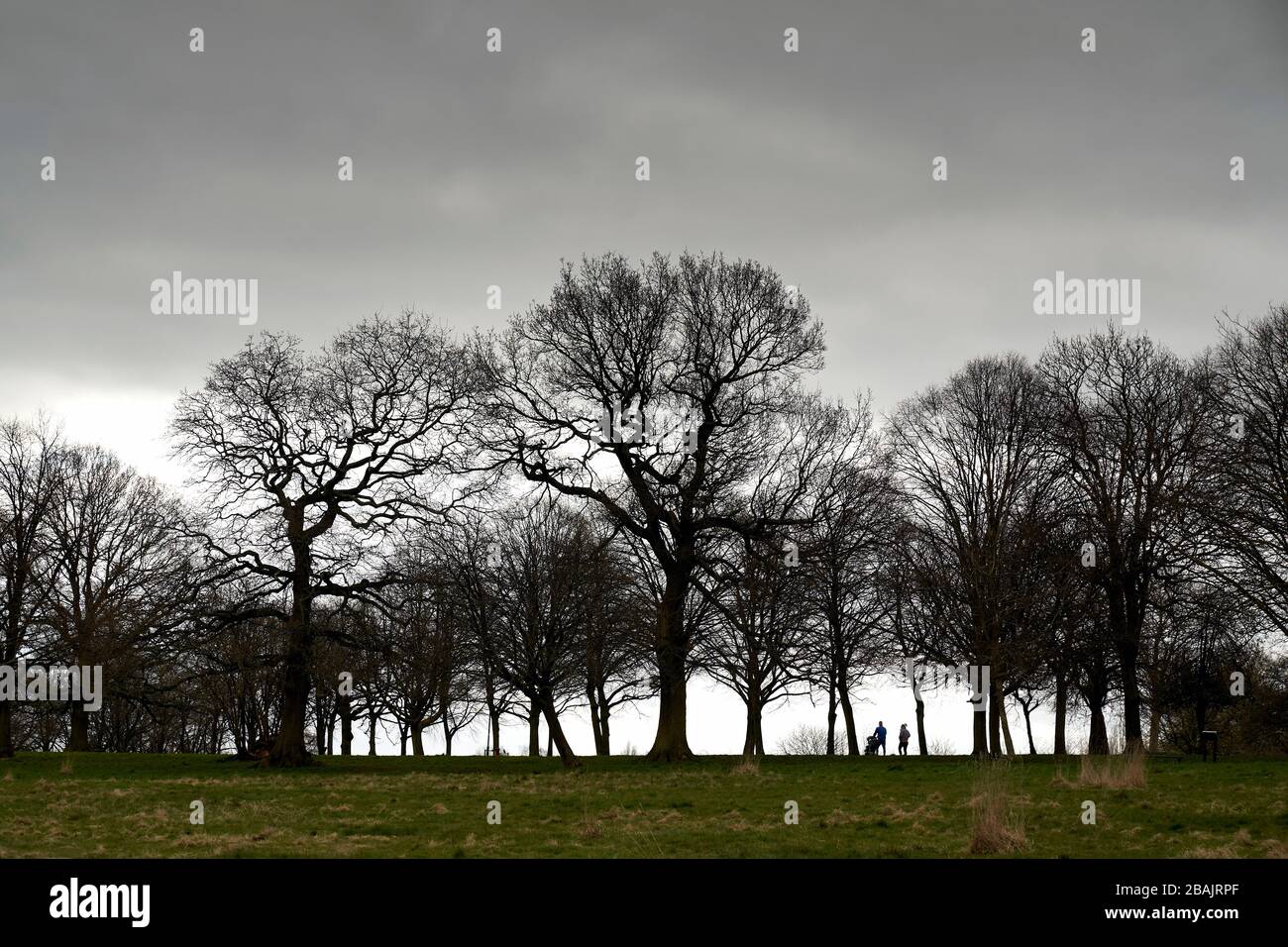 Birmingham, UK. 28th Mar, 2020. A family takes a walk in Selly Oak park, Birmingham UK today.  The UK Government are encouraging people to walk at least 2 meters apart and to exercise once a day to help stop the spread of Coranavirus (Covid-19) Credit: Edward Moss/Alamy Live News Stock Photo