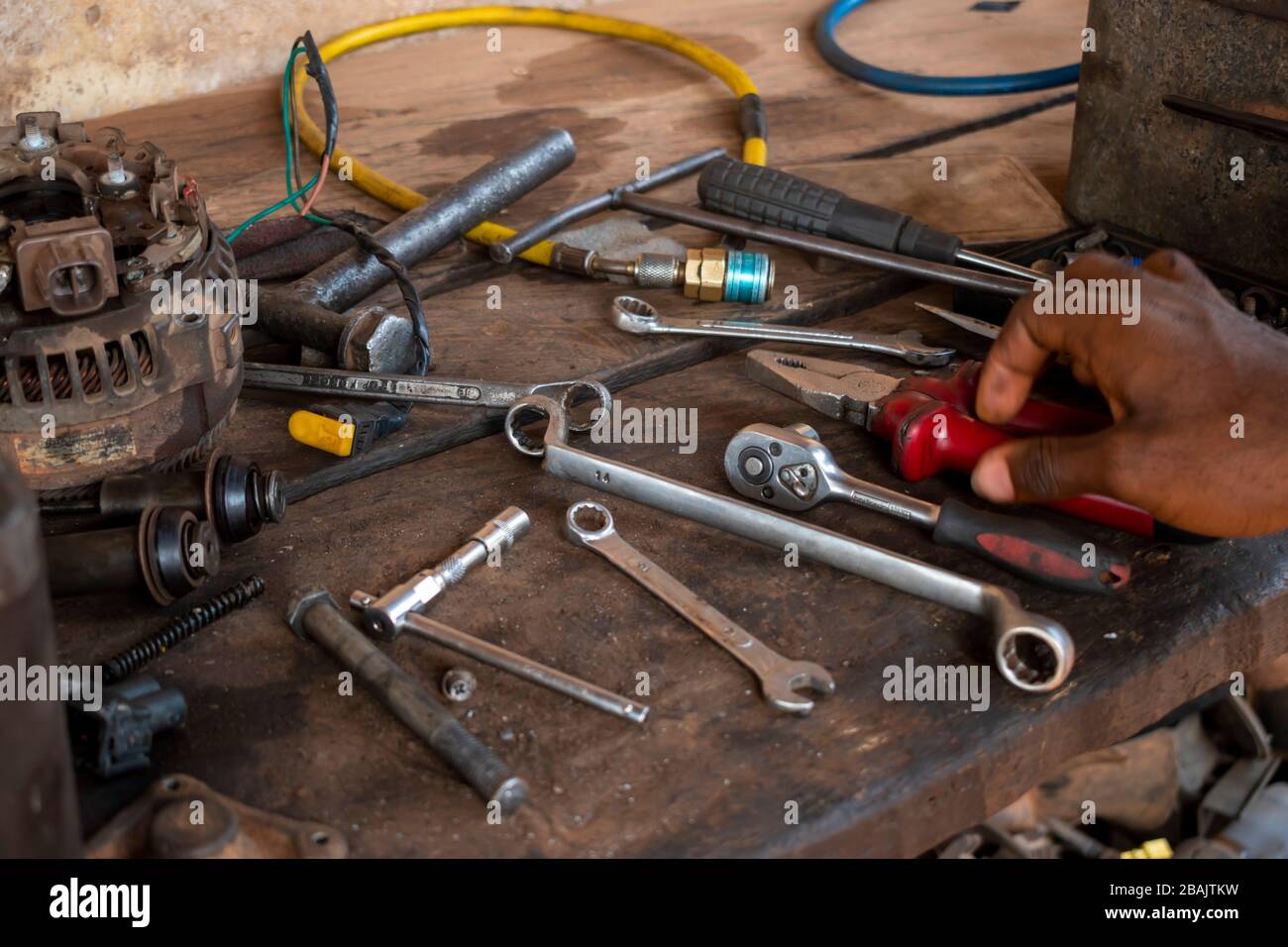 hand screwdriver spanner and tools on a mechanical table Stock Photo