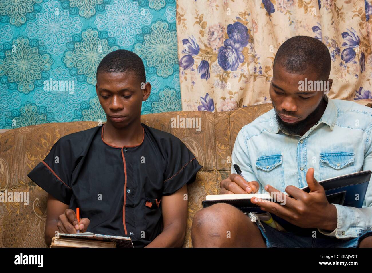two young african students seriously studying his note Stock Photo