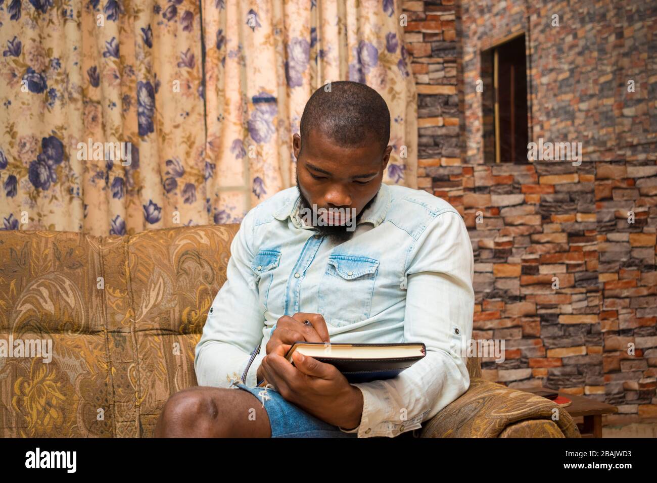 young african student seriously studying his note Stock Photo