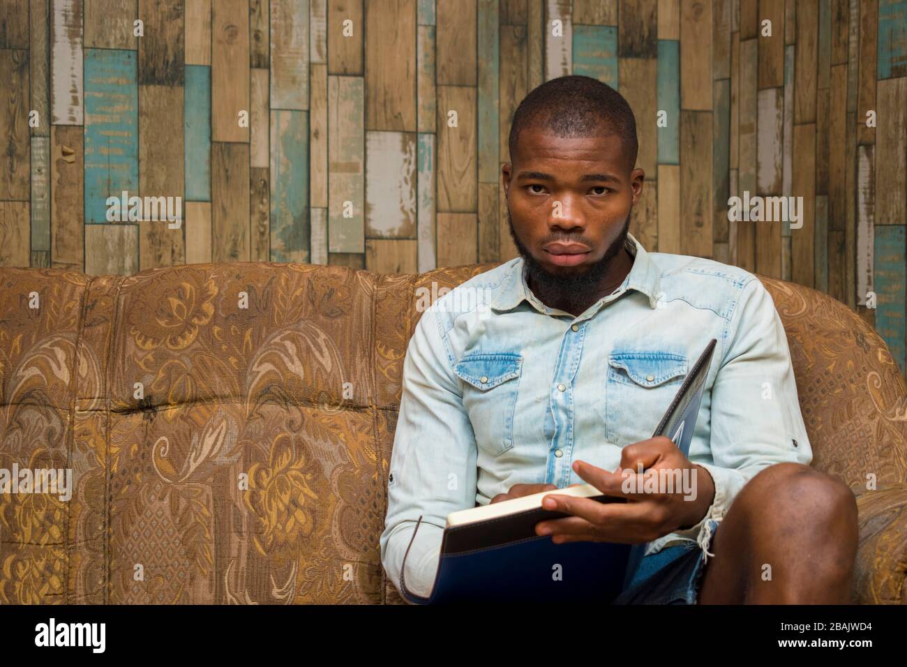 young african student seriously studying his note Stock Photo