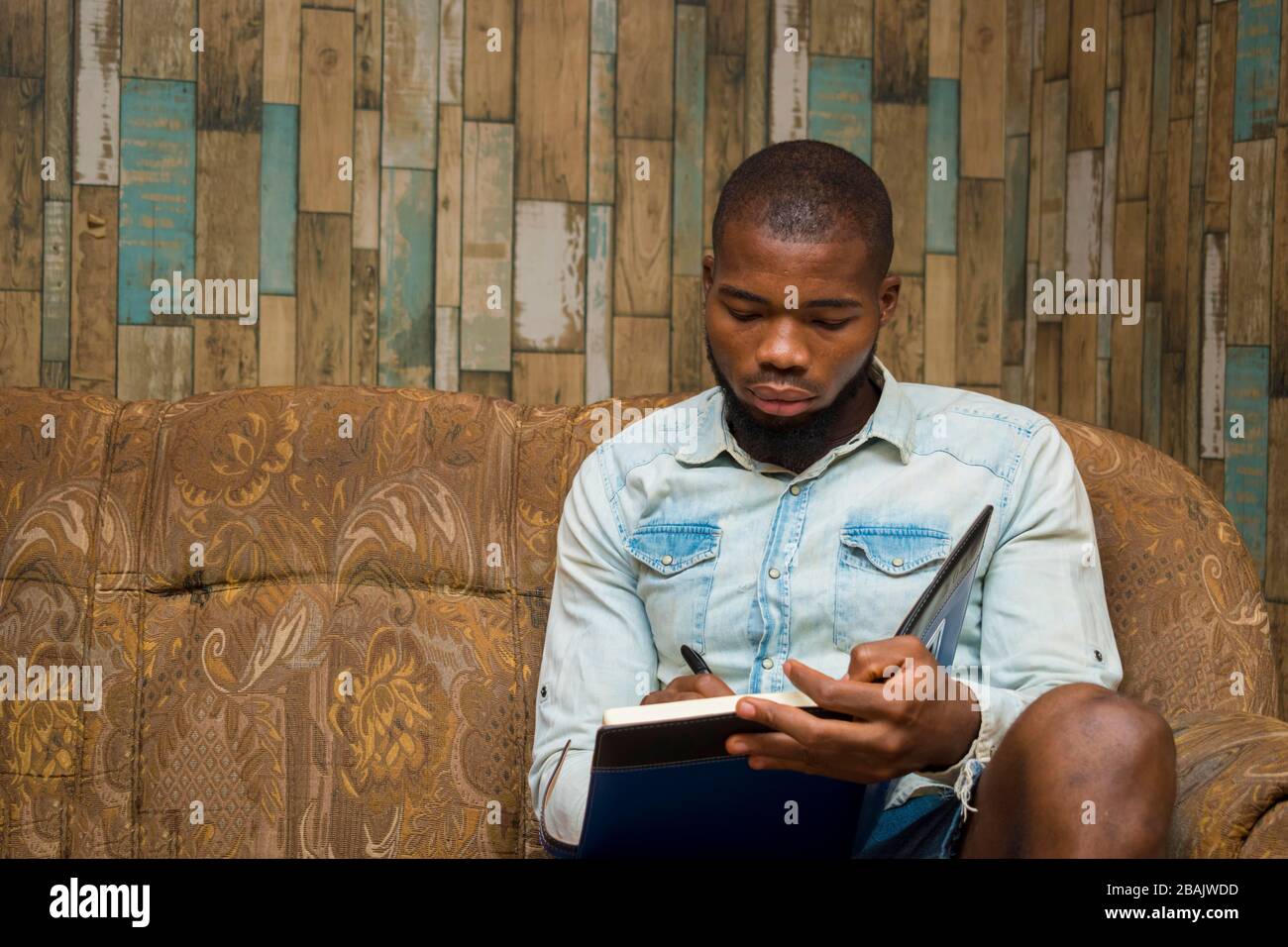 young african student seriously studying his note Stock Photo