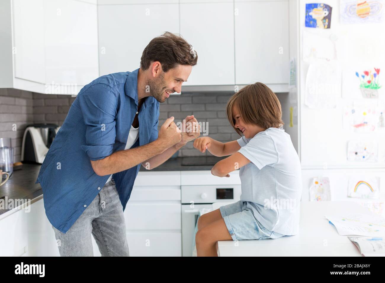 Father and son in the kitchen Stock Photo