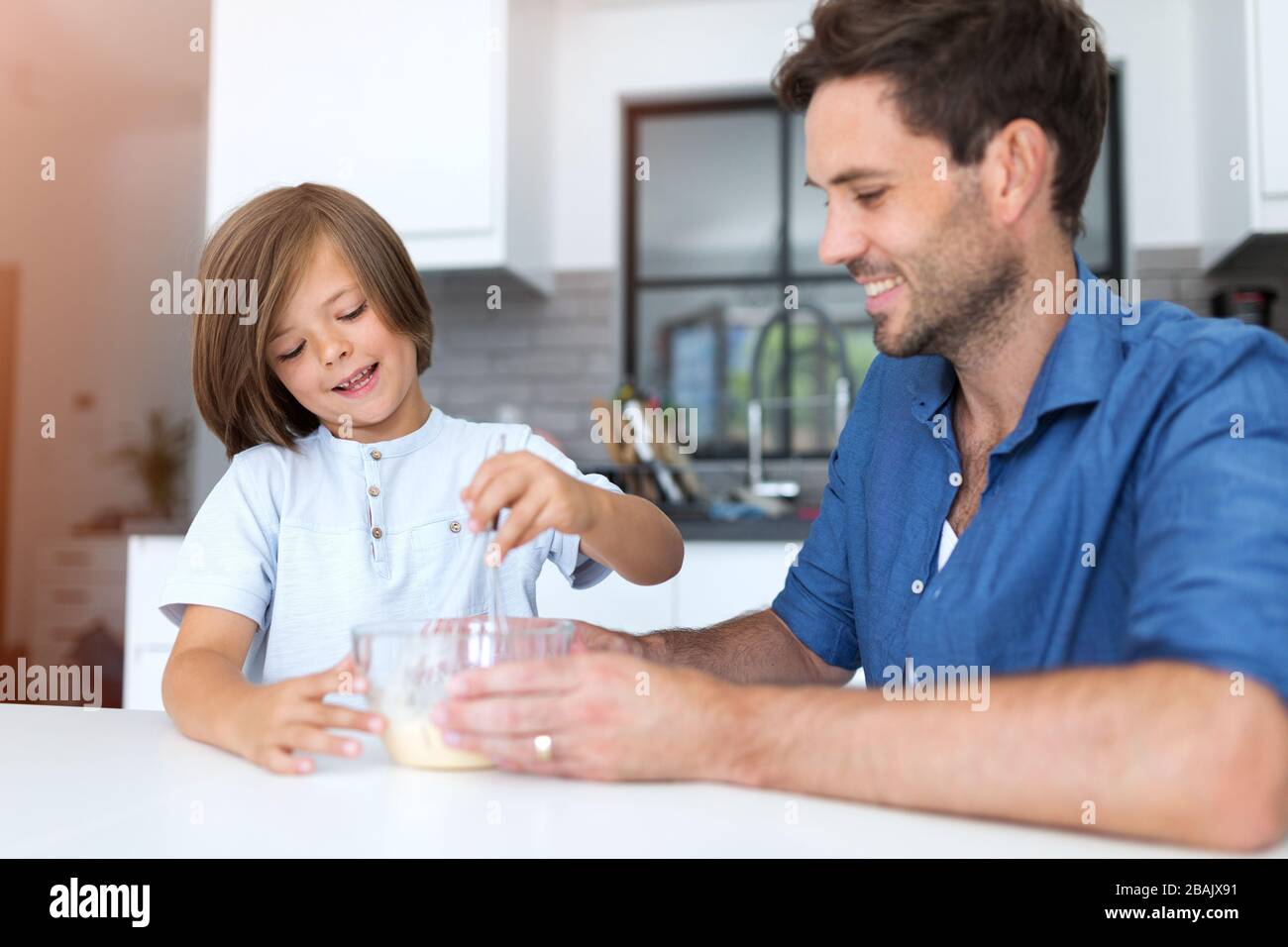 Father and son in the kitchen Stock Photo