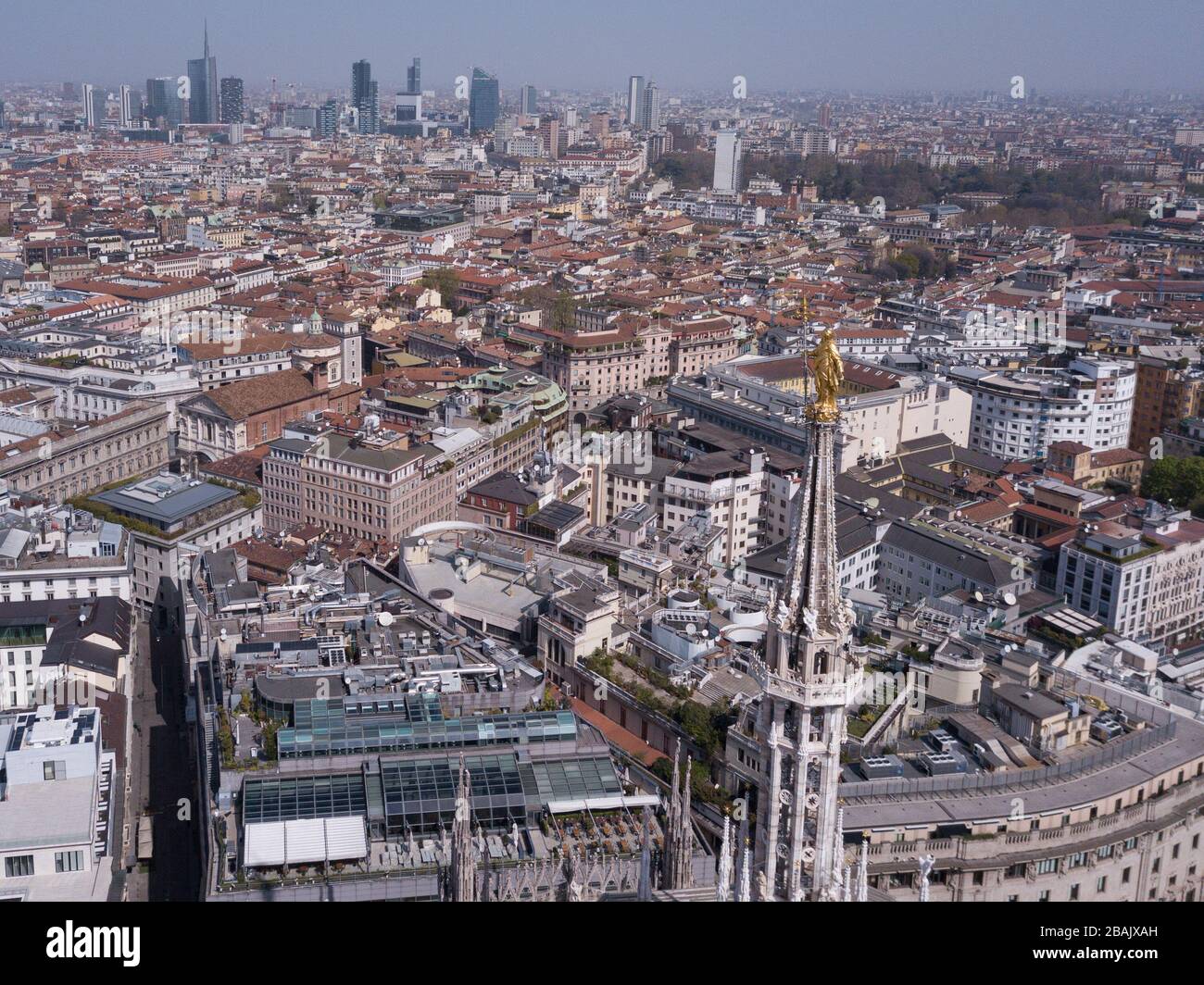 Milan, Italy. 28th Mar, 2020. Milan drone takes back the deserted streets  and squares because of the quarantine for the Coronavirus COVID19,  panoramic shot of Piazza Del Duomo Madonnina (Davide Salerno/Fotogramma,  Milan -