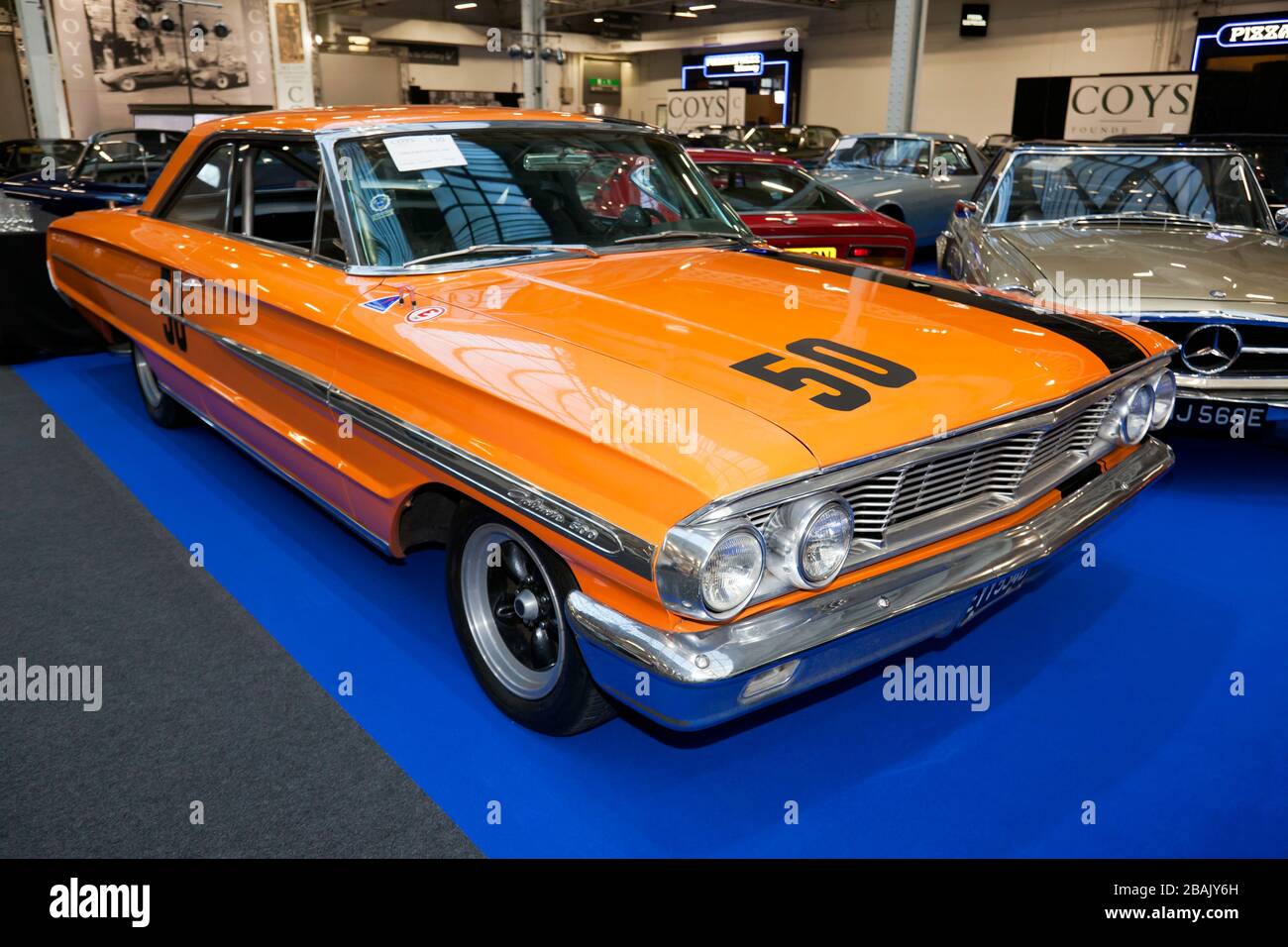 Three-quarters front view of a 1964,  Ford Galaxie 500 Race Car,  on display at the Coys Auction Area of the 2020 London Classic Car Show Stock Photo
