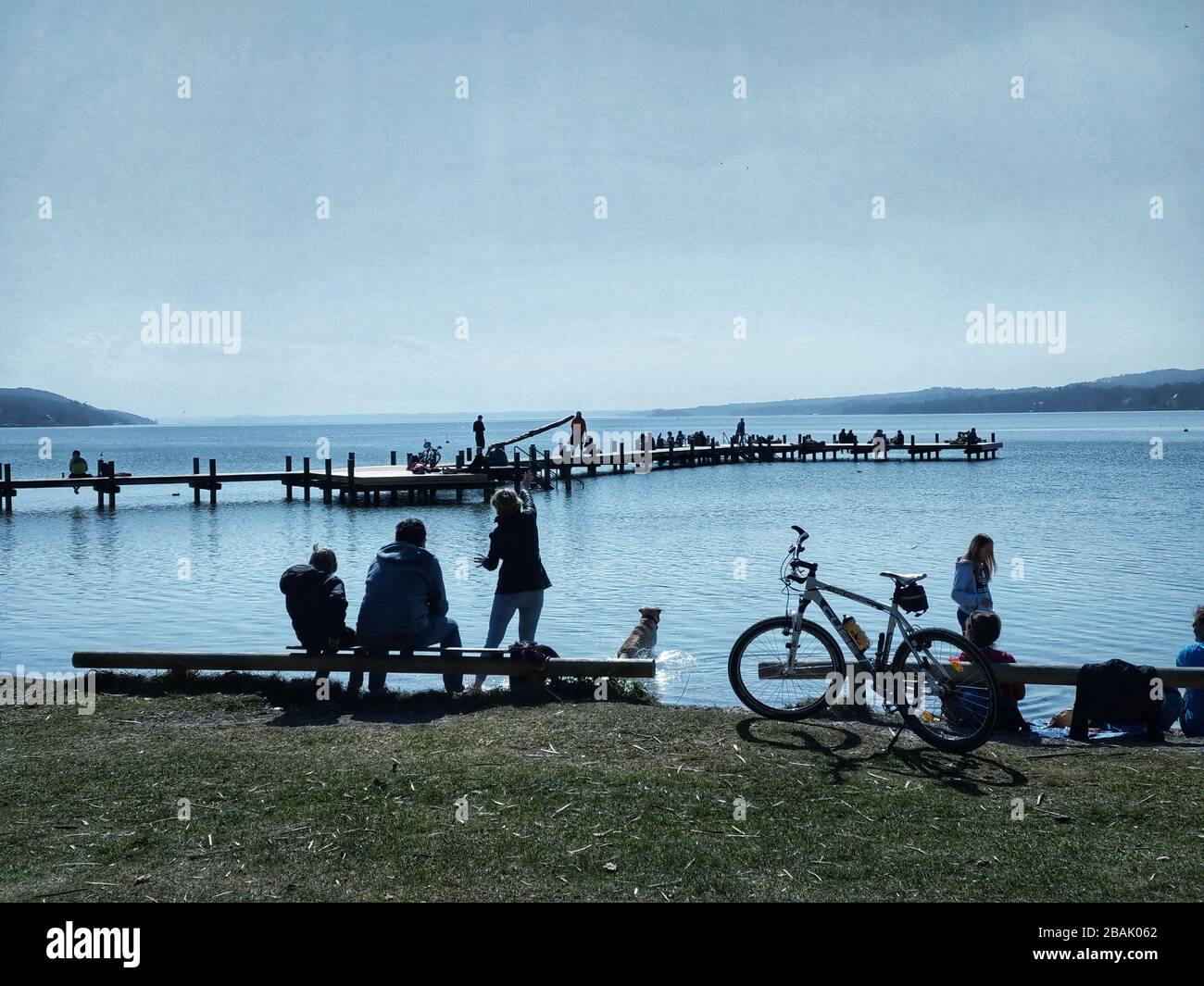 Lake Starnberg, Bavaria, Germany. 28th Mar, 2020. Despite the #stayinside and #savelives campaigns that run in addition to social and physical distancing guidelines, many in the Lake Starnberg area near Munich, Germany enjoy meeting in groups under sunny skies. Credit: Sachelle Babbar/ZUMA Wire/Alamy Live News Stock Photo