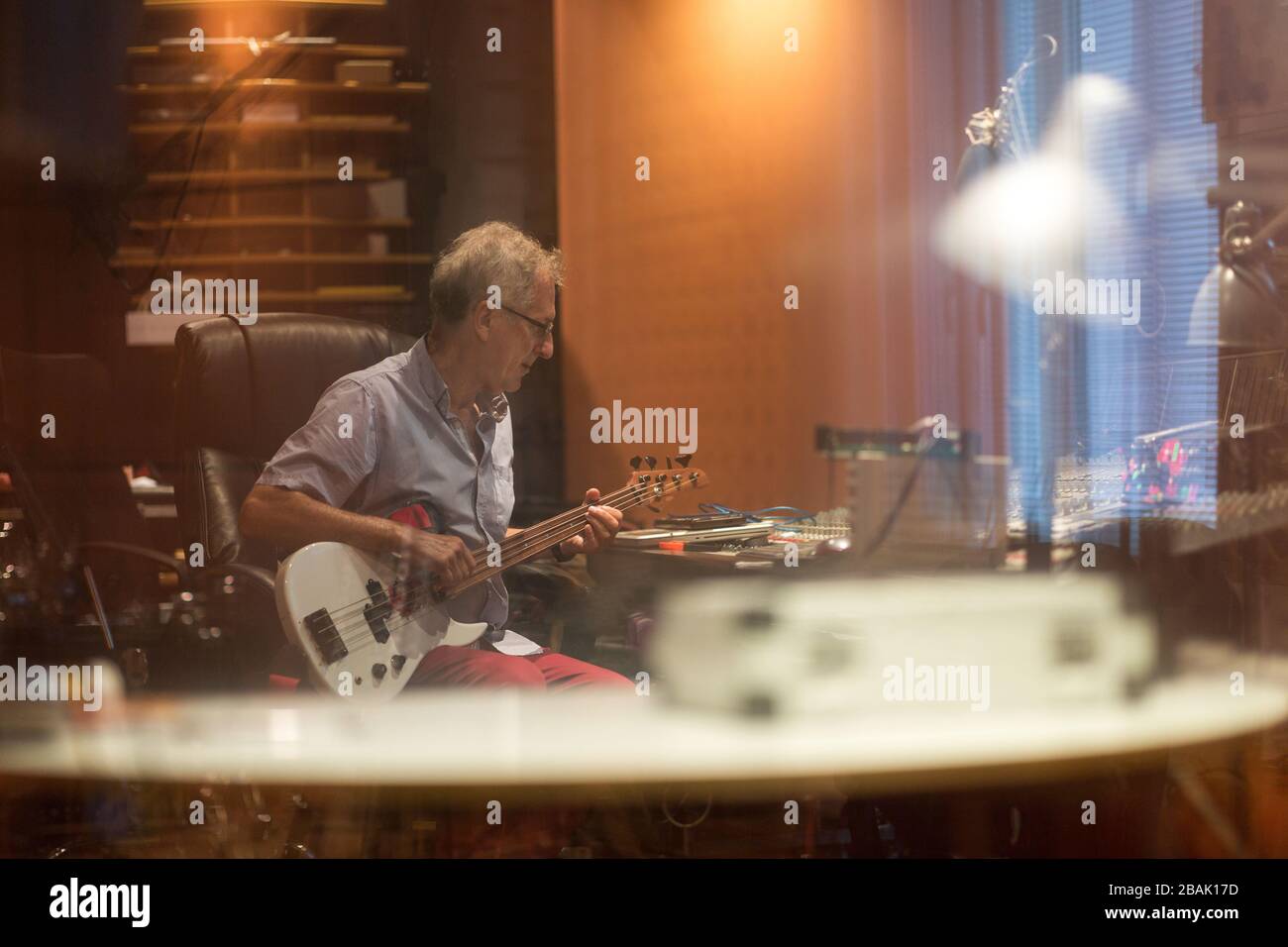 Mature man at mixing desk in a recording studio Stock Photo