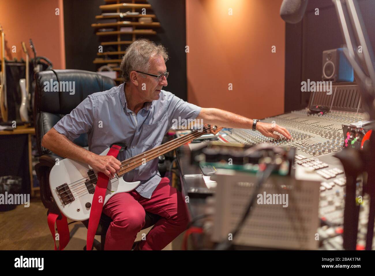 Mature man at mixing desk in a recording studio Stock Photo