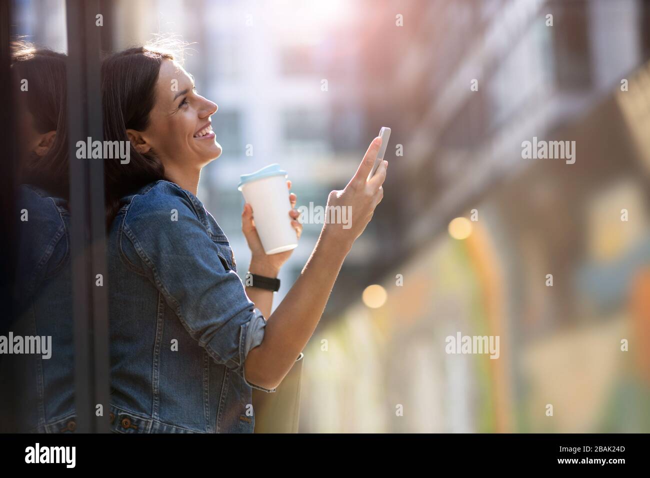 Portrait of young woman in urban area Stock Photo