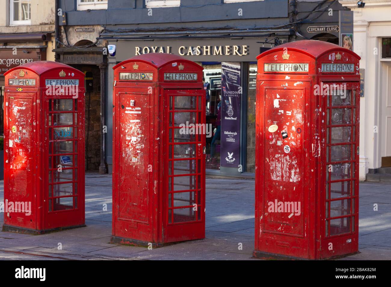 Three red British Telephone Boxes in row on the Royal Mile, Edinburgh Stock Photo