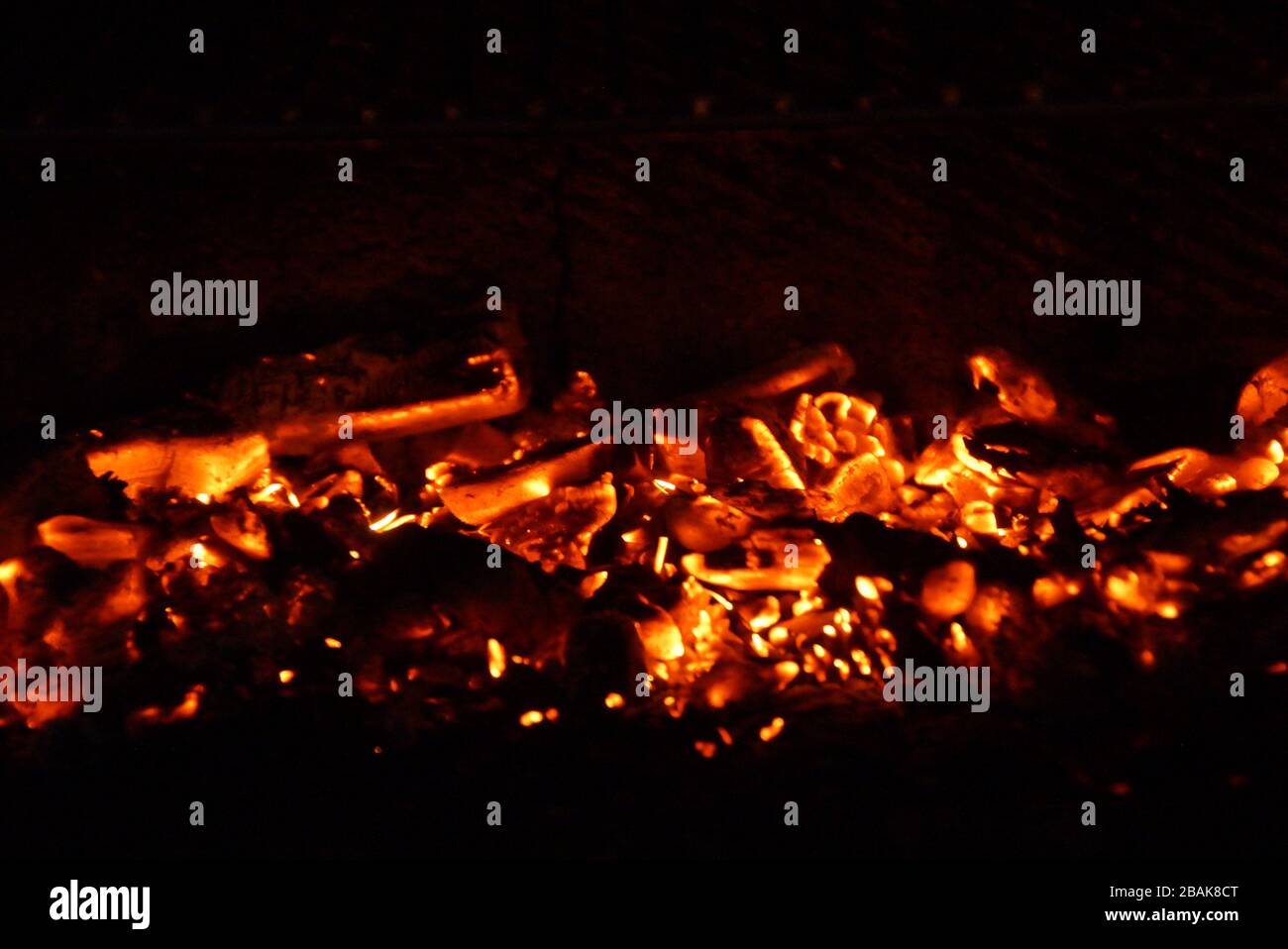 Embers in the barbecue, with an orange bright color Stock Photo