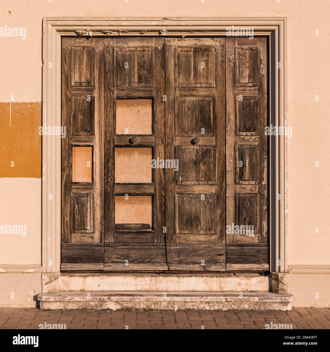 An old door on a derelict and abandoned building in Senigallia, Italy Stock Photo
