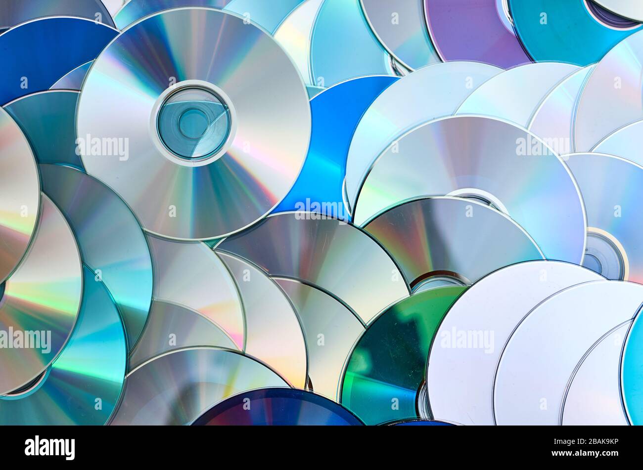 Group of old CD DVD compact optical disk storage medium with dust and scratches Stock Photo