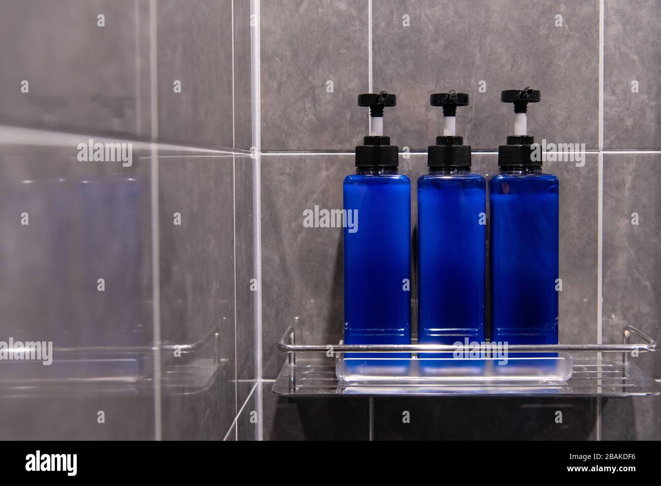 Body Wash, Shampoo, and Conditioner are packed in blue bottles in the