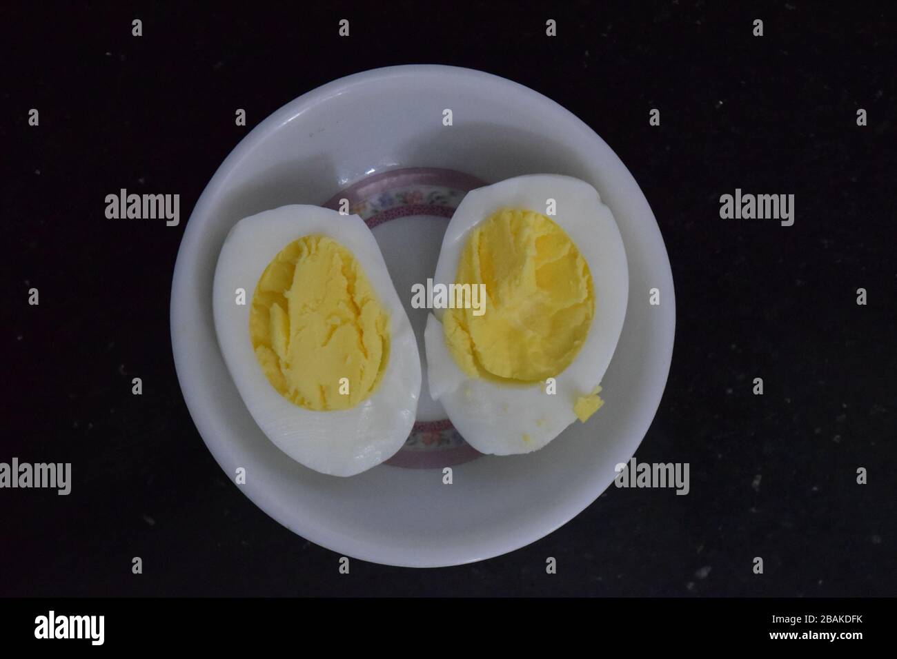 Full boil egg divided into half Stock Photo Alamy