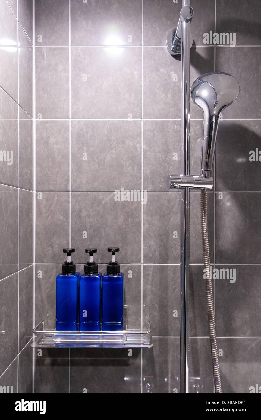 Body Wash, Shampoo, and Conditioner are packed in blue bottles in the