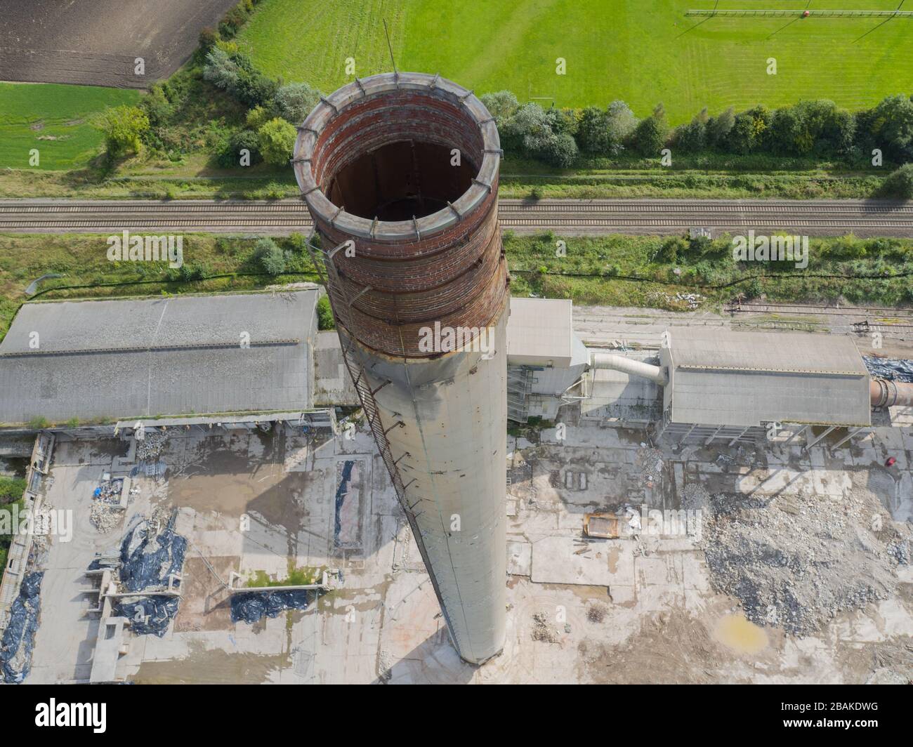 Demolition of the chimney at Westbury Cement Works in Wiltshire in 2016. Stock Photo