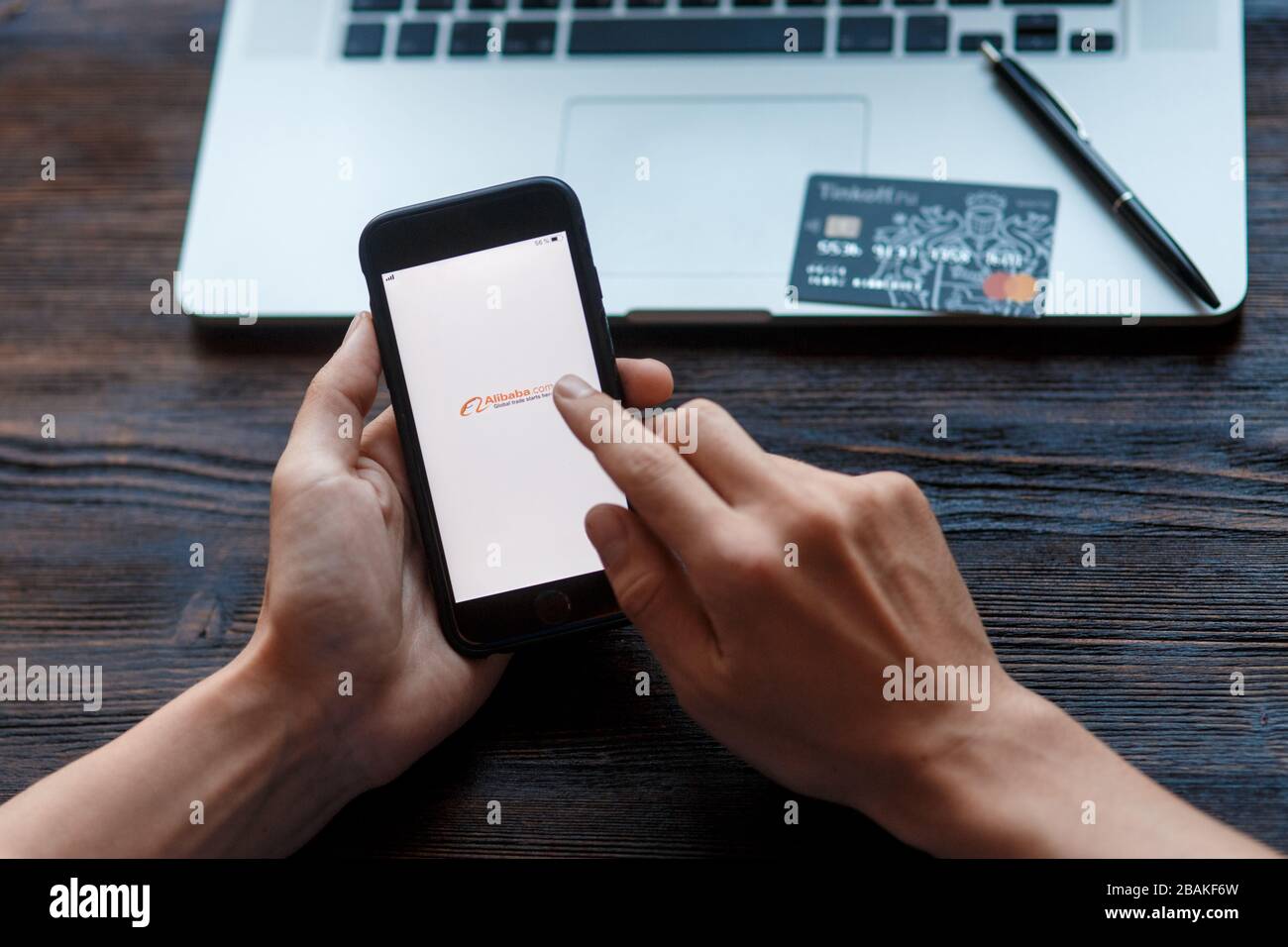 Man hands holding HUAWEI with alibaba apps on screen. Alibaba the the world biggest online commerce company. Its three main sites Taobao,Tmall and Stock Photo