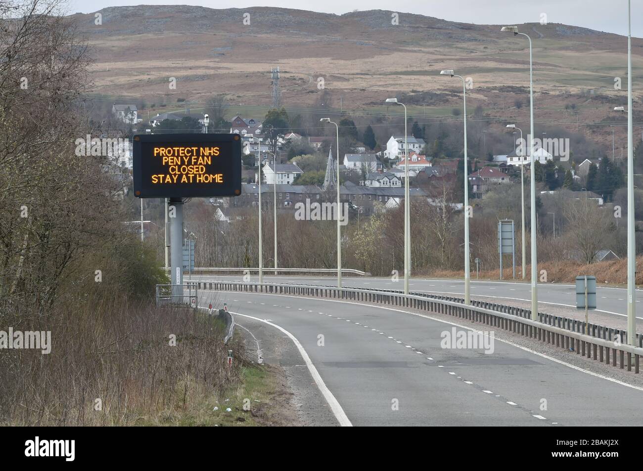 A sign on the empty A470 in Merthyr Tydfil, heading towards Brecon, informing drivers that Pen Y Fan is closed to visitors, as the UK continues in lockdown to help curb the spread of the coronavirus. Stock Photo