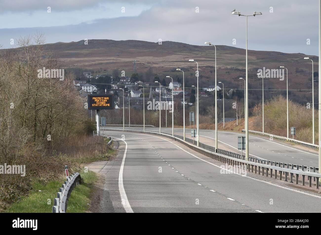 A sign on the empty A470 in Merthyr Tydfil, heading towards Brecon, informing drivers that Pen Y Fan is closed to visitors, as the UK continues in lockdown to help curb the spread of the coronavirus. Stock Photo