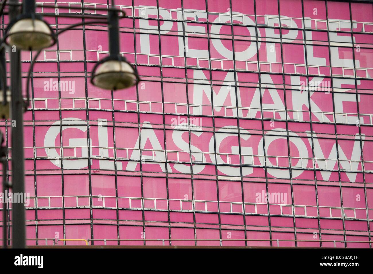 Glasgow, UK. 27 March 2020.   Pictured: Sign on the side of the old Glasgow Building and Printing College, which displays, “PEOPLE MAKE GLASGOW”   The Coronavirus Pandemic has forced the UK Government to order a shut down of all the UK major cities and make people stay at home. Stock Photo