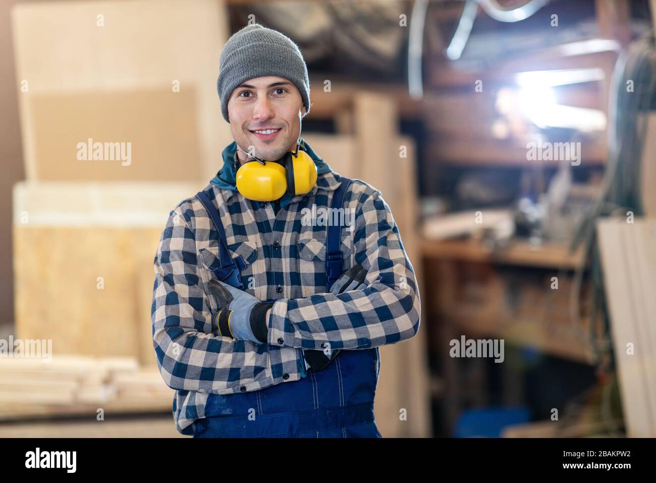 Young male worker in timber warehouse Stock Photo